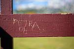 Graffiti on wooden handrail