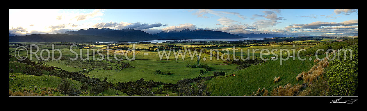 Image of Panorama of Lake Te Anau, farmland and Fiordland National Park from above Te Anau township, Te Anau, Southland District, Southland Region, New Zealand (NZ) stock photo image