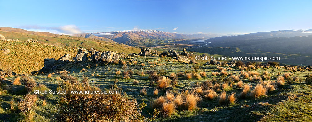 Image of Panorama looking down on Cromwell, Ripponvale, the Clutha River Valley and Lake Dunstan from the Carrick Range. Pisa Range centre, Dunstan mountains right. Rock tors, Bannockburn, Central Otago District, Otago Region, New Zealand (NZ) stock photo image