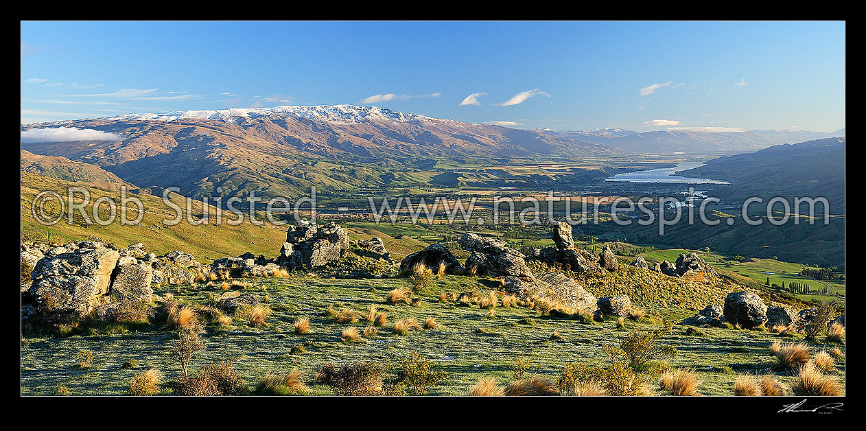 Image of Panorama looking down on Cromwell, Ripponvale, the Clutha River Valley and Lake Dunstan from the Carrick Range. Pisa Range left. Rock tors, Bannockburn, Central Otago District, Otago Region, New Zealand (NZ) stock photo image