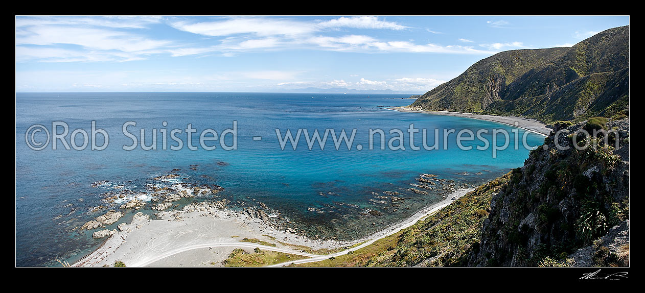 Image of Cook Strait viewed from Sinclair Head and the Wellington South Coast. South Island visible under cloud bank, Cook Strait, Wellington City District, Wellington Region, New Zealand (NZ) stock photo image