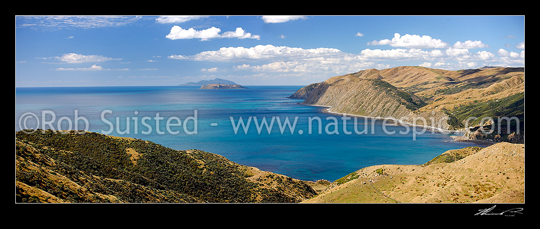 Image of Looking over Wharehou Bay towards Mana and Kapiti islands with Pipinui Point centre. Ohariu and Smiths Bay (with baches) at right. Makara Beach, Makara, Wellington City District, Wellington Region, New Zealand (NZ) stock photo image