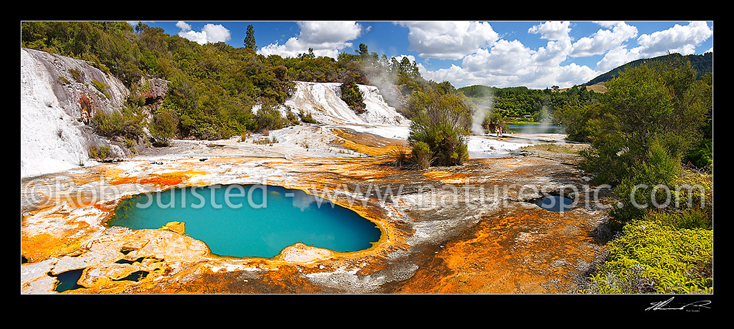 Image of Visitors viewing the geothermal Rainbow and Cascade terraces at the Orakei Korako cave and thermal park - the Hidden Valley. Lake Ohakuri beyond, Rotorua, Rotorua District, Bay of Plenty Region, New Zealand (NZ) stock photo image