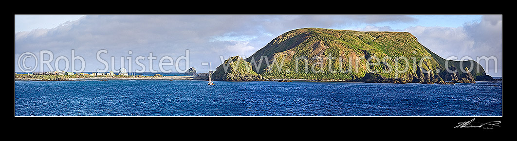 Image of ANARE Macquarie Island station on Isthmus with yacht in Buckles Bay. Wireless Hill right. World Heritage Site and Area. Panorama, Macquarie Island, NZ Sub Antarctic District, NZ Sub Antarctic Region, New Zealand (NZ) stock photo image