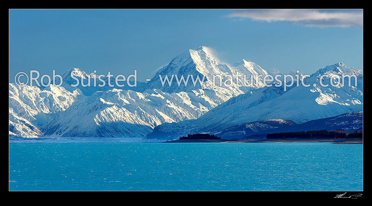 Image of Aoraki / Mount Cook (3754m) and Lake Pukaki in winter. Mt La Perouse (3078m) left, Burnett Mountains Range far right. Panorama, Aoraki / Mount Cook National Park, MacKenzie District, Canterbury Region, New Zealand (NZ) stock photo image