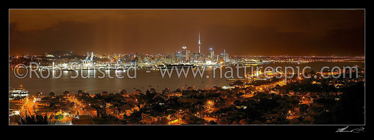 Image of Auckland City night time panorama of CBD, buildings, waterfront, port and Sky tower from Mount Victoria, Devonport, Auckland City, Auckland City District, Auckland Region, New Zealand (NZ) stock photo image