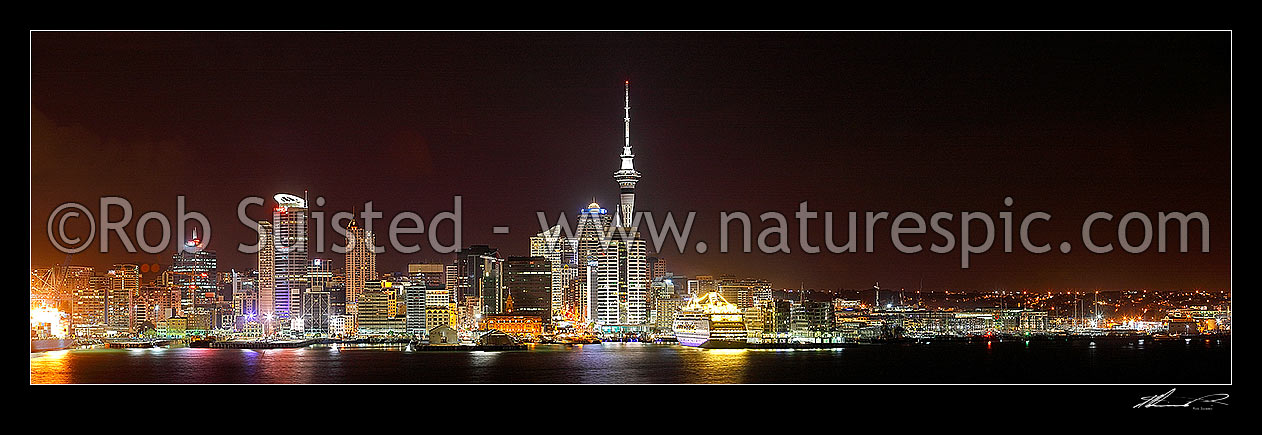 Image of Auckland City night time panorama of CBD, buildings, waterfront and Sky tower from Devonport, with cruise ship berthed, Auckland City, Auckland City District, Auckland Region, New Zealand (NZ) stock photo image