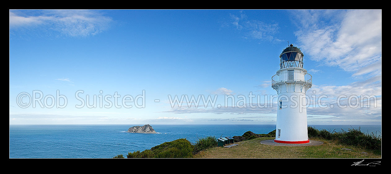 Image of East Cape lighthouse on hill (141m) above East Island (Whangoakeno) left. Panorama, East Cape, Gisborne District, Gisborne Region, New Zealand (NZ) stock photo image