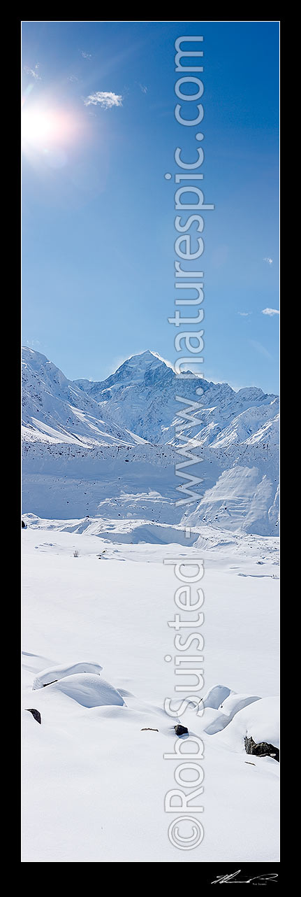 Image of Aoraki / Mount Cook (3754m left) in winter snow. Looking over the Mueller Glacier and lake up the Hooker River Valley. Mt Cook Range right. Vertical panorama, Aoraki / Mount Cook National Park, MacKenzie District, Canterbury Region, New Zealand (NZ) stock photo image