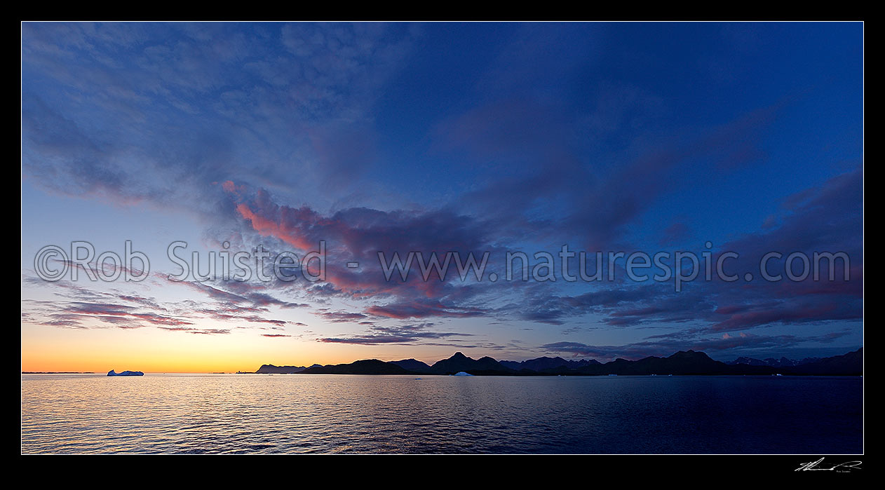 Image of Greenlandic sunset, fiords, mountains and icebergs near Narsarmijit in Kujalleq municipality, Prins Christian Sund, South Greenland, Greenland stock photo image