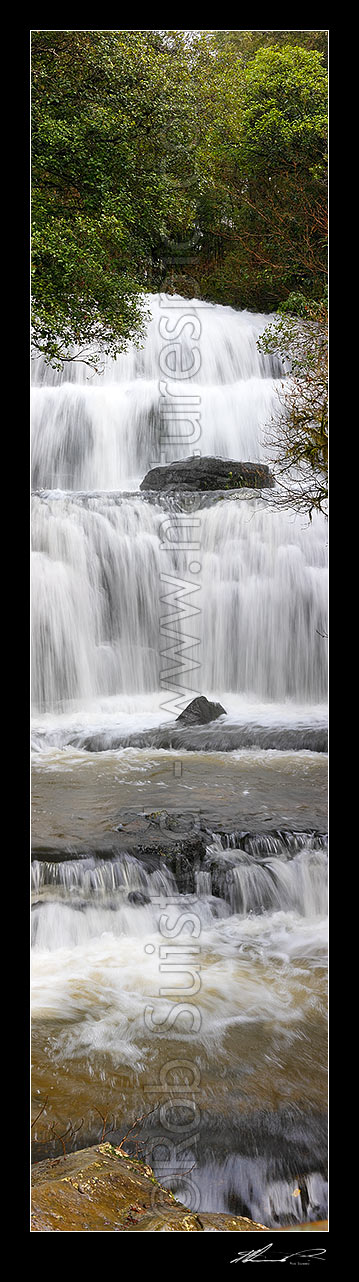 Image of Waterfall cascading over several falls into pool. Purakaunui River falls. Vertical panorama, Catlins, Clutha District, Otago Region, New Zealand (NZ) stock photo image