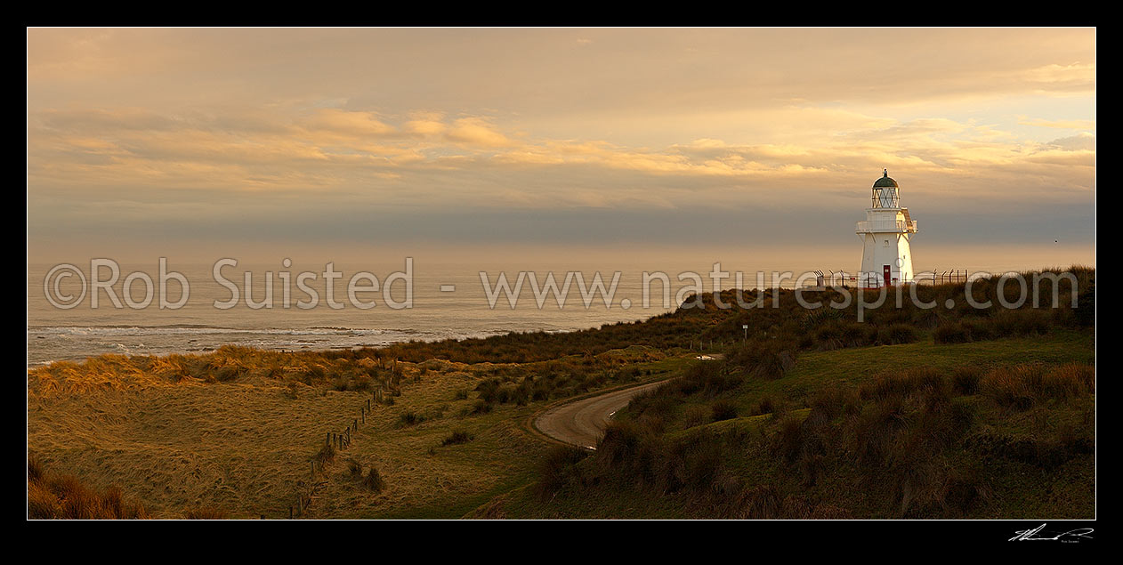 Image of Waipapa Point lighthouse and beach panorama on a moody evening, Fortrose, Southland District, Southland Region, New Zealand (NZ) stock photo image