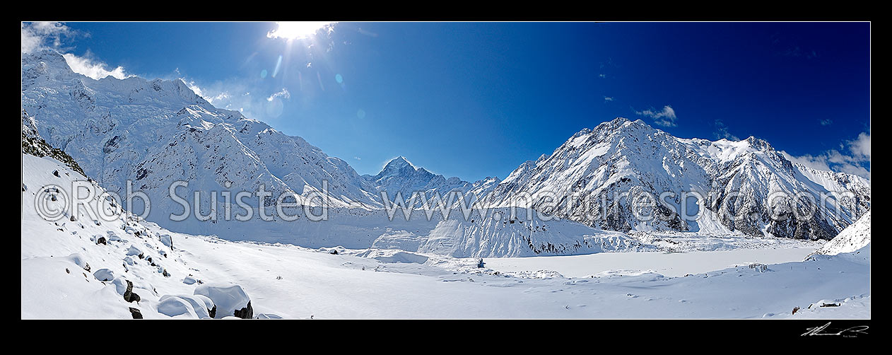 Image of Aoraki / Mount Cook (3754m centre) in winter snow. Looking over the Mueller Glacier and lake up the Hooker River Valley. Mt Sefton and Huddlestone Glacier left, Mt Cook Range right. Panorama, Aoraki / Mount Cook National Park, MacKenzie District, Canterbury Region, New Zealand (NZ) stock photo image