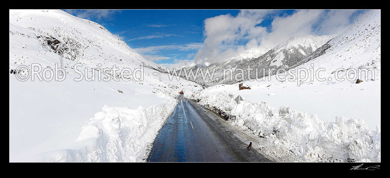 Image of Arthur's Pass road in heavy winter snow. State Highway 73 to West Coast. Looking east with road clearing machinery working. Panorama, Arthur's Pass National Park, Selwyn District, Canterbury Region, New Zealand (NZ) stock photo image