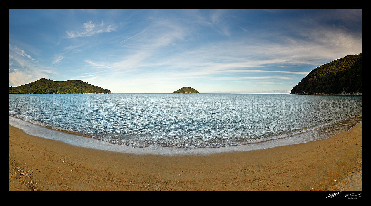 Image of Abel Tasman National Park at Onetahuti Beach, with Tonga Island (centre) and Reef Point (left) beyond. Tonga Roadstead. Golden sand beach. Panorama, Abel Tasman National Park, Tasman District, Tasman Region, New Zealand (NZ) stock photo image