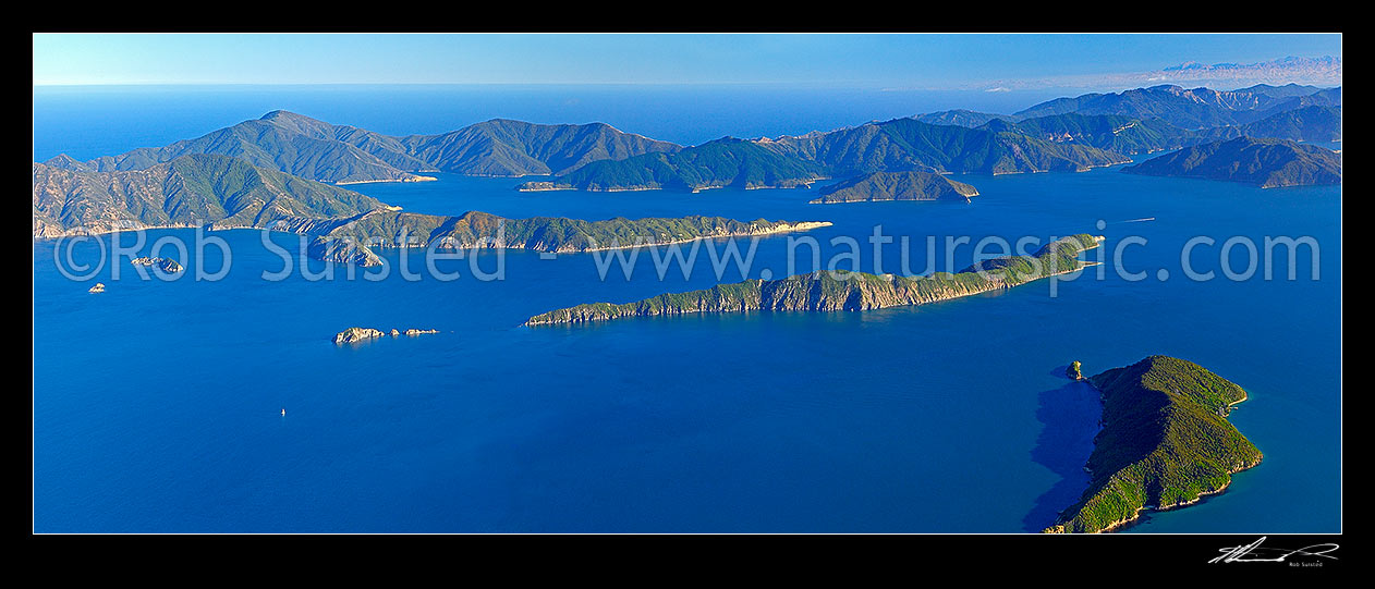 Image of Outer Marlborough Sounds in Queen Charlotte Sound (Totaranui). Arapaoa (Arapawa) Island and East Bay left, Long Island and Kokomohua Islands centre. Motuara Island right. Kaikoura Ranges distant right, Marlborough Sounds, Marlborough District, Marlborough Region, New Zealand (NZ) stock photo image