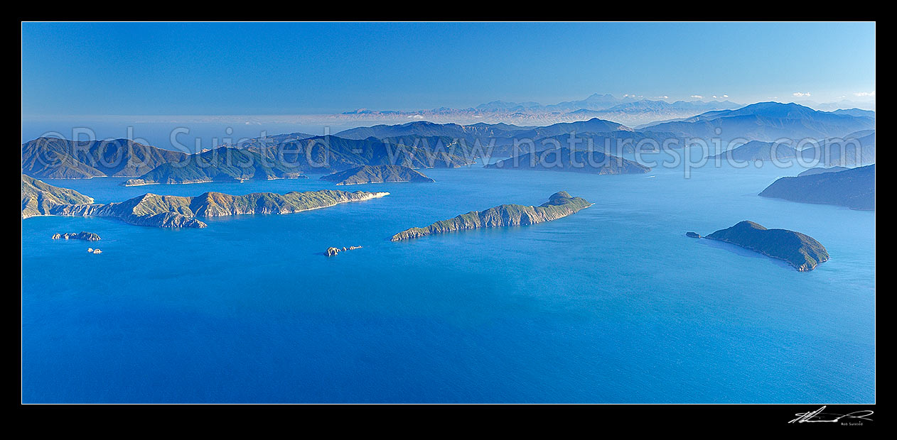 Image of Outer Marlborough Sounds in Queen Charlotte Sound (Totaranui). Arapaoa (Arapawa) Island and East Bay left, Long Island and Kokomohua Islands centre. Motuara Island right. Kaikoura Ranges distant right, Marlborough Sounds, Marlborough District, Marlborough Region, New Zealand (NZ) stock photo image