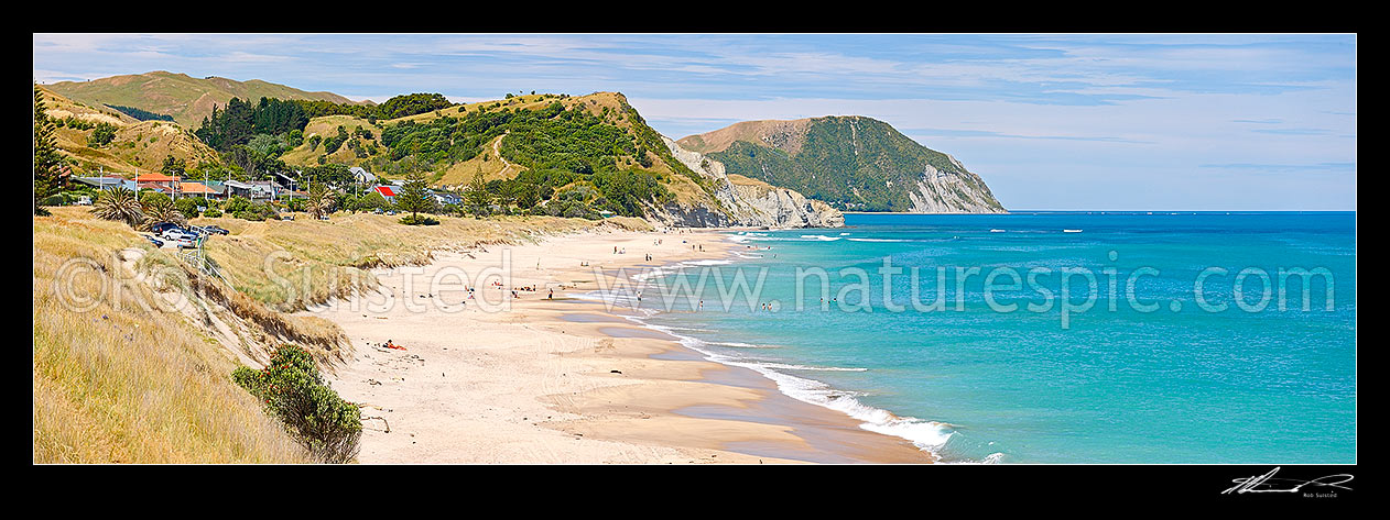 Image of Wainui Beach summer panorama. Makarori Point middle, with Tatapouri Point beyond, Wainui Beach, Gisborne District, Gisborne Region, New Zealand (NZ) stock photo image