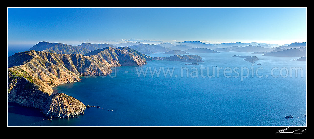 Image of Arapaoa (Arapawa) Island at head of Queen Charlotte Sound. Cape Koamaru and Te Huahua Bay left. Kokomohua and Long Island left. Aerial panorama. Kaikoura Ranges distant, Arapawa Island, Marlborough Sounds, Marlborough District, Marlborough Region, New Zealand (NZ) stock photo image