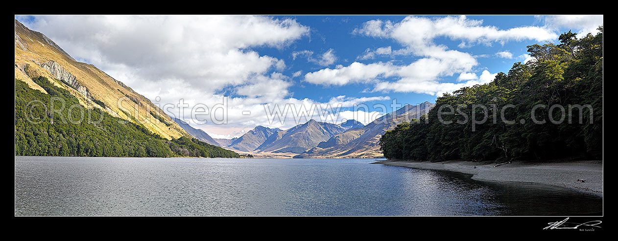 Image of North Mavora Lake nestled between the Livingstone and Thomson Mountains ranges. Snowdon Forest Conservation Area & Mararoa River Valley panorama, Mavora Lakes, Te Anau, Southland District, Southland Region, New Zealand (NZ) stock photo image