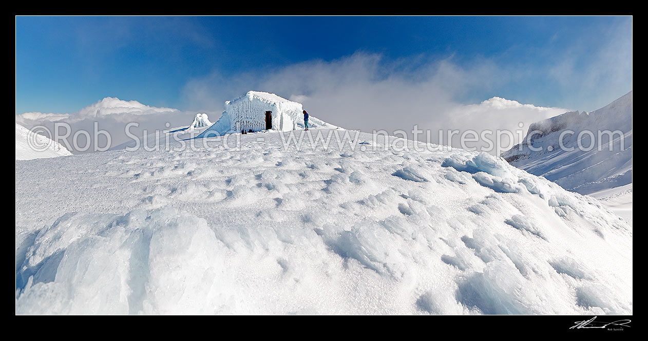 Image of Symes Hut on Fantham's Peak (Panitahi) at 1962 m, on the side of Mt Taranaki, encrusted with winter ice. Panorama, Egmont National Park, Taranaki, Stratford District, Taranaki Region, New Zealand (NZ) stock photo image