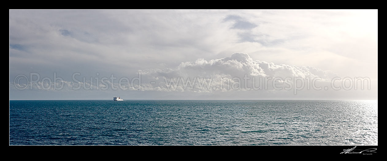 Image of Interislander Cook Strait ferry Kaitaki crossing in the middle of Cook Strait under dramatic sky. Large panorama file suitable for murals, Cook Strait, Wellington City District, Wellington Region, New Zealand (NZ) stock photo image