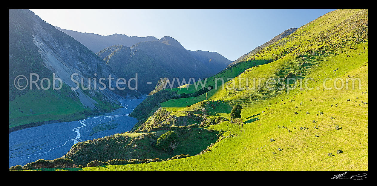 Image of Mukamuka Stream and Wharekauhau Station farmland beside the Remutaka (Rimutaka) Forest Park. South Saddle visible centre. Panorama, Palliser Bay, South Wairarapa District, Wellington Region, New Zealand (NZ) stock photo image