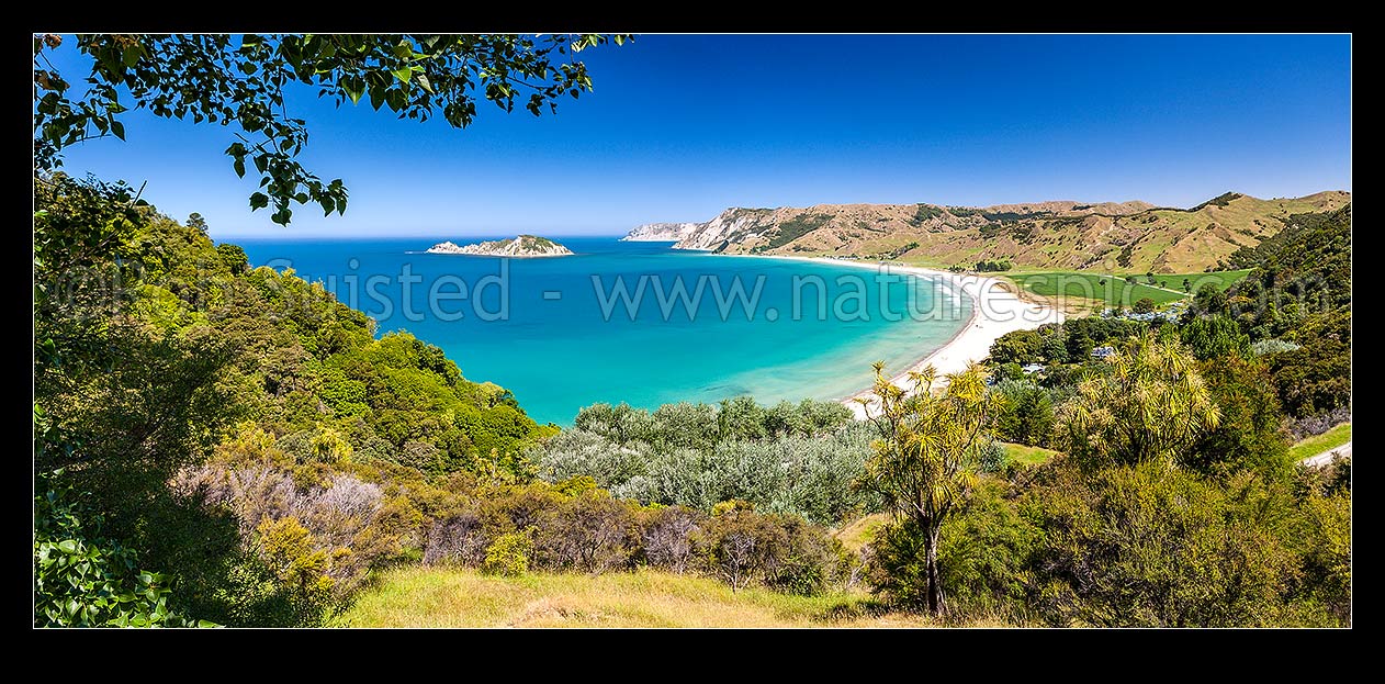 Image of Anaura Bay with Motuoroi Island left and Marau Point in distance. Site of Captain James Cook landing in 1769. Panorama, Anaura Bay, East Coast, Gisborne District, Gisborne Region, New Zealand (NZ) stock photo image