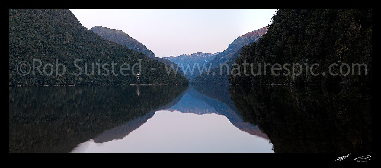 Image of Lake Te Anau Narrows from the Glaisnock River beach at twilight. Turret Peaks behind. Panorama, Fiordland National Park, Southland District, Southland Region, New Zealand (NZ) stock photo image