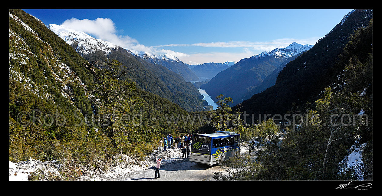 Image of Real Journeys coach on the Wilmot Pass Road for tourists to photograph Deep Cove and Doubtful Sound on a beautiful winter day, Doubtful Sound, Fiordland National Park, Southland District, Southland Region, New Zealand (NZ) stock photo image