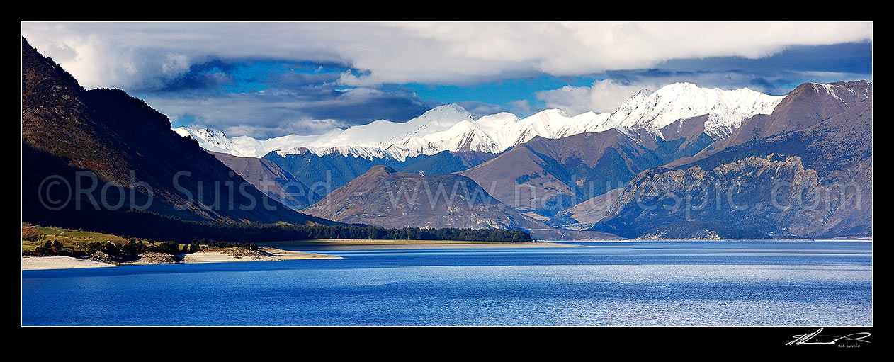 Image of Lake Hawea, looking past Bushy Point to the Dingle Burn (centre left), the Peninsula, Dingle Burn Station and Silver Island (right). Panorama, Lake Hawea, Otago, Queenstown Lakes District, Otago Region, New Zealand (NZ) stock photo image