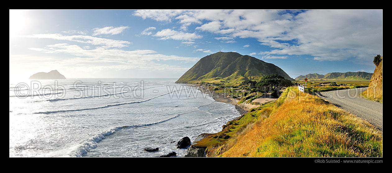 Image of East Cape lighthouse and East Island (Wharekeno), and coastline below East Coast Road. Panorama, East Cape, Gisborne District, Gisborne Region, New Zealand (NZ) stock photo image