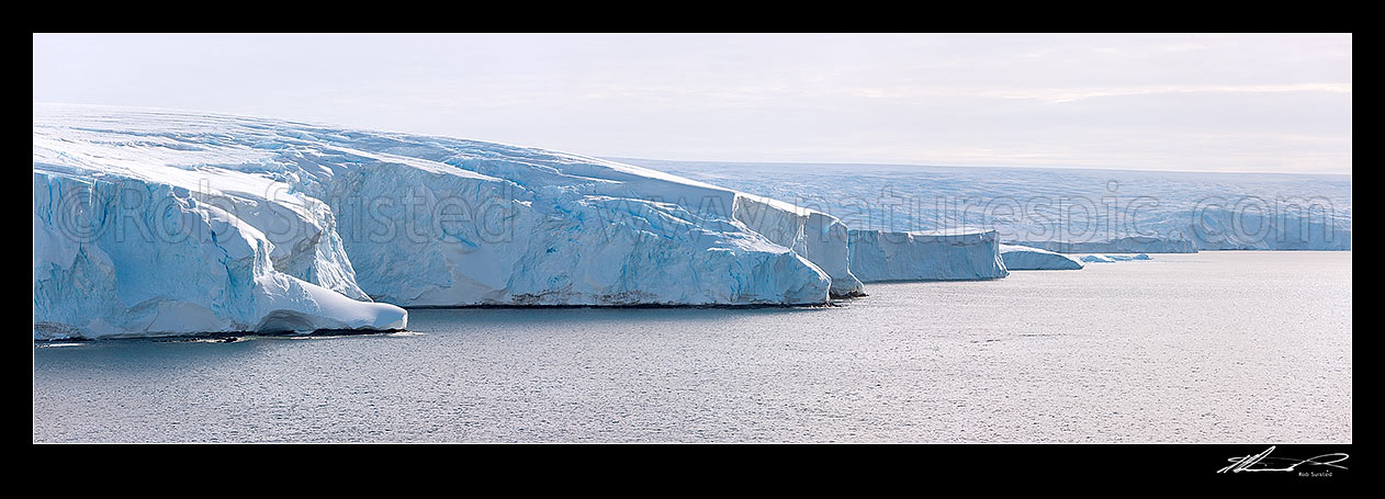 Image of Polar ice cap descending to the sea in George V land near Cape Denison, Commonwealth Bay. Panorama, George V Land, Antarctica Region, Antarctica stock photo image