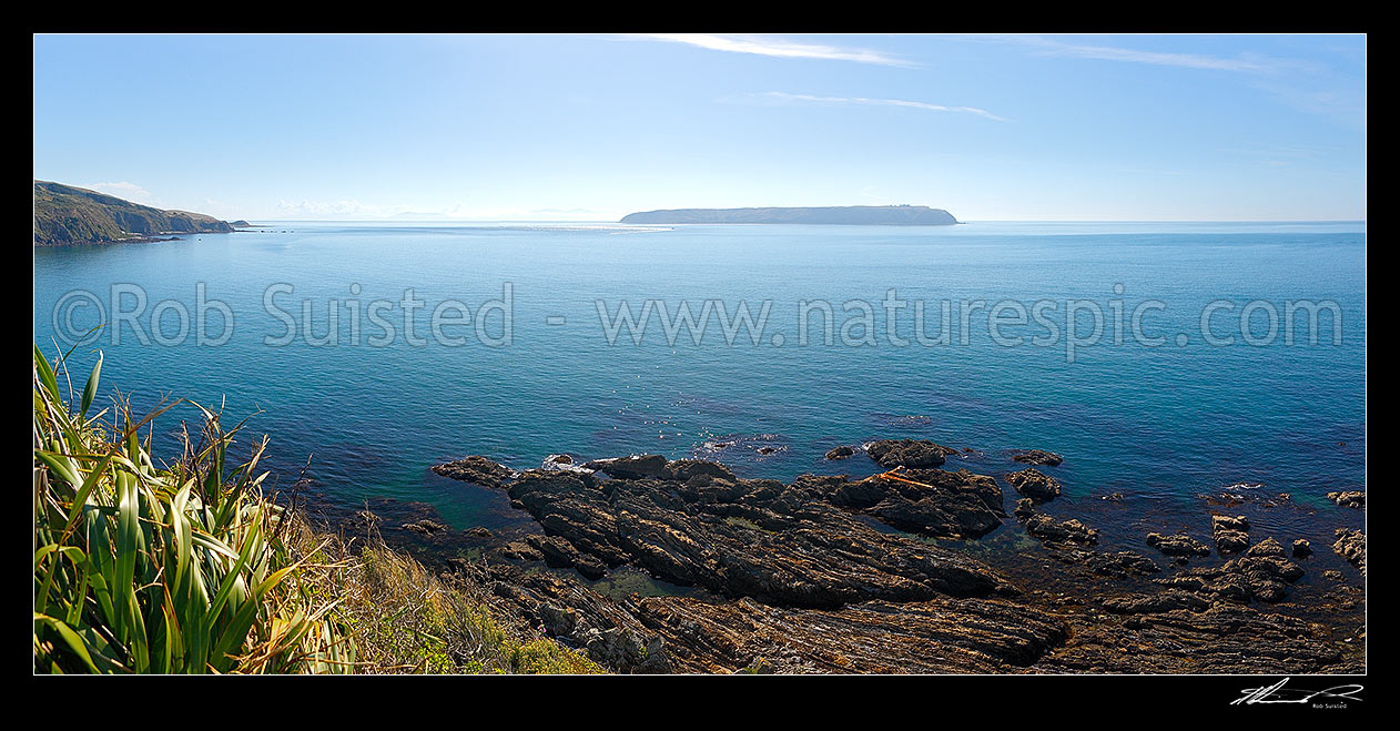 Image of Mana Island seen from Titahi Bay and Te Paokapo Point. South Island just visible in distance behind. Panorama, Mana Island, Porirua City District, Wellington Region, New Zealand (NZ) stock photo image