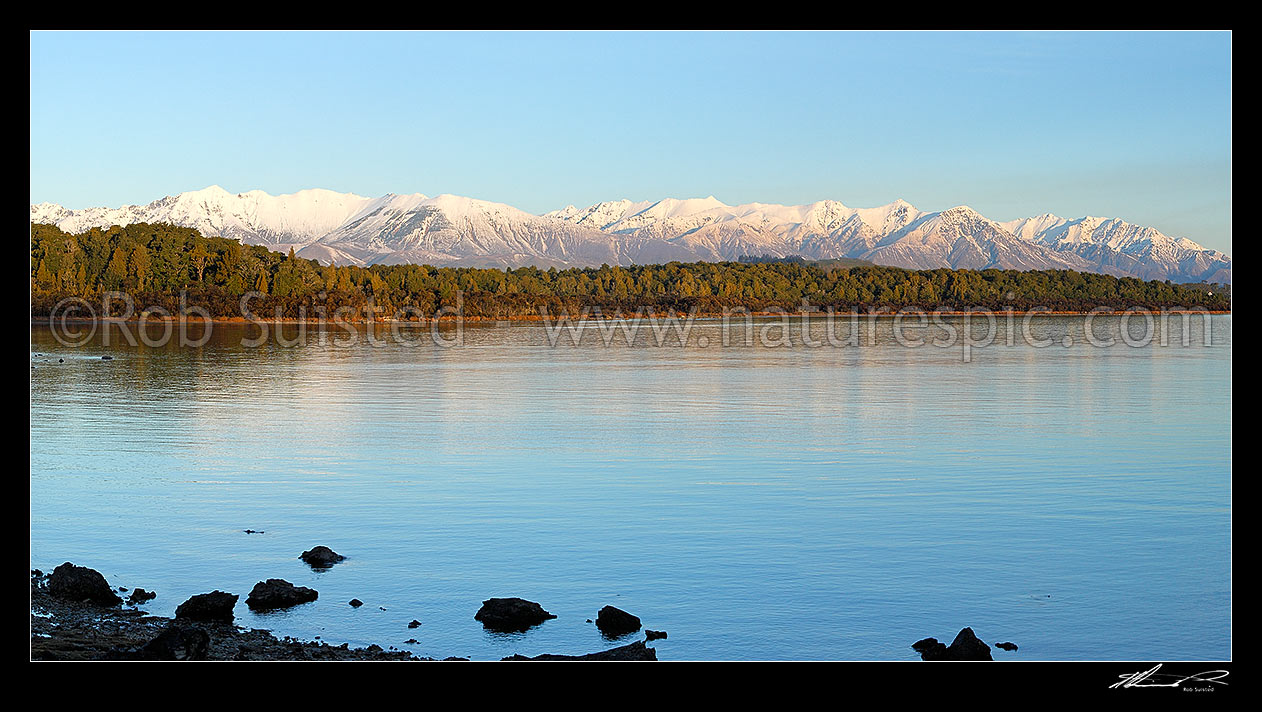 Image of Lake Manapouri panorama looking towards to snowy Takitimu Mountains range in winter, Manapouri, Southland District, Southland Region, New Zealand (NZ) stock photo image