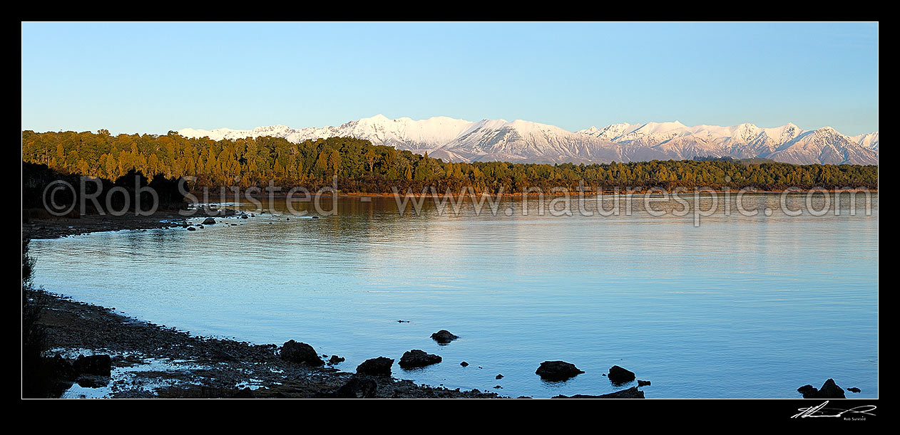 Image of Lake Manapouri panorama looking towards to snowy Takitimu Mountains range in winter, Manapouri, Southland District, Southland Region, New Zealand (NZ) stock photo image