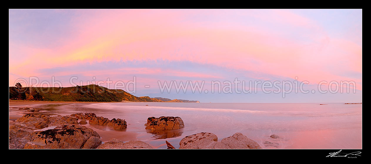 Image of Sunset at Port Awanui and Te Wharau Beach. Whakaumu, East Cape and East Island (Whangaokeno) visible in distance. Panorama, Port Awanui, East Coast, Gisborne District, Gisborne Region, New Zealand (NZ) stock photo image