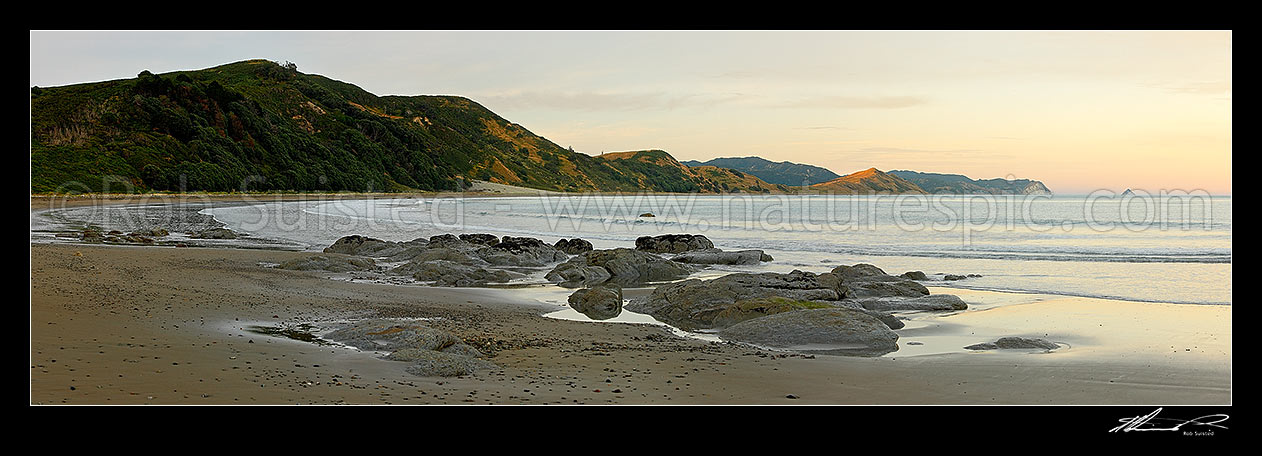 Image of Sunrise at Port Awanui and Te Wharau Beach. Whakaumu Peak, Waikori Bluff and East Island (Whangaokeno) visible in distance. Panorama, Port Awanui, East Coast, Gisborne District, Gisborne Region, New Zealand (NZ) stock photo image