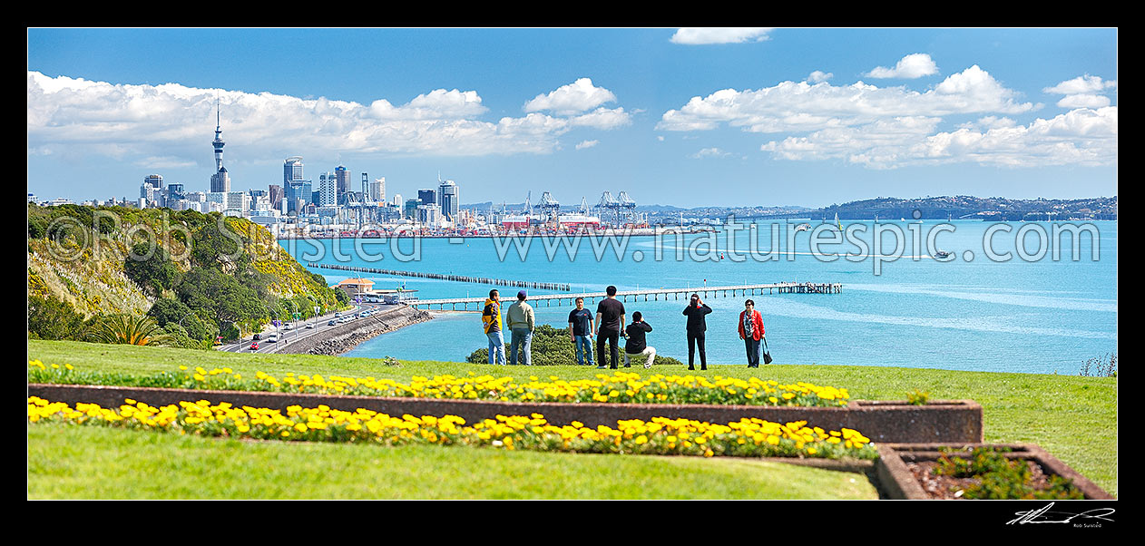 Image of Auckland City, waterfront and Waitemata Harbour photo from near Mission Bay. Asian tourists taking photos with ferries and yachts behind. Bastion Point. Panorama, Auckland City, Auckland City District, Auckland Region, New Zealand (NZ) stock photo image