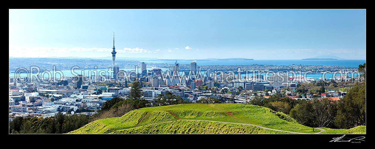 Image of Sweeping view over Auckland City and Waitemata Harbour from Mount Eden (Maungawhau) volcanic cone. Panorama. Mt Eden, Auckland City, Auckland City District, Auckland Region, New Zealand (NZ) stock photo image