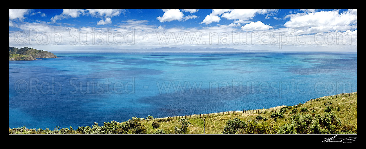 Image of Cook Strait. Ohau Point at left, South Island, Marlborough Sounds and The Brothers in distance. Summer panorama from above Opau Bay, Makara Beach, Wellington City District, Wellington Region, New Zealand (NZ) stock photo image