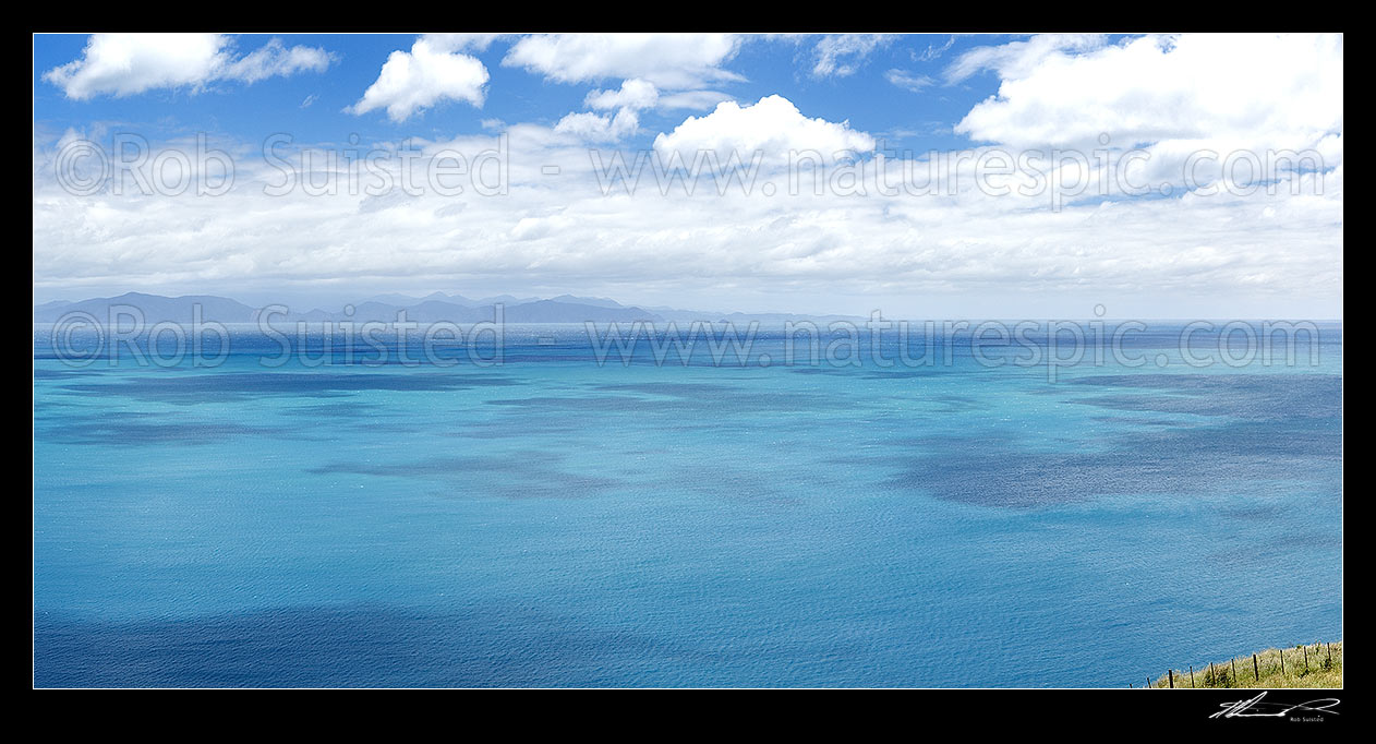 Image of Cook Strait. South Island, Marlborough Sounds and The Brothers in distance. Summer view from above Opau Bay, Makara Beach, Makara Beach, Wellington City District, Wellington Region, New Zealand (NZ) stock photo image