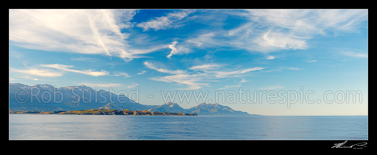 Image of Kaikoura Peninsula with Seaward Kaikoura Range and Mt ManaKau (2608m) at left, Mount Alexander (1197m, Puhipuhi Syncline visible) centre, and Mt Batty (1195m) centre right. Panorama, Kaikoura, Kaikoura District, Canterbury Region, New Zealand (NZ) stock photo image