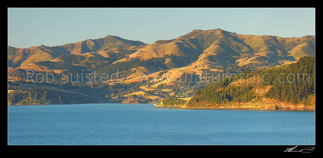 Image of Akaroa Harbour, looking past Takamatua to Robinsons Bay near the head of the harbour. Duvauchelle Peak (738m) above left. Panorama, Banks Peninsula, Christchurch City District, Canterbury Region, New Zealand (NZ) stock photo image