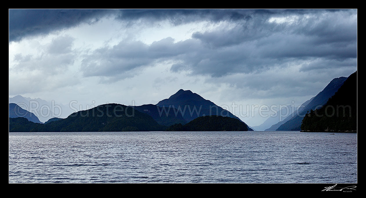 Image of Dusky Sound moody panorama. Long Island centre left and Cook Channel right, taken from Pickersgil Harbour, Dusky Sound, Fiordland National Park, Southland District, Southland Region, New Zealand (NZ) stock photo image