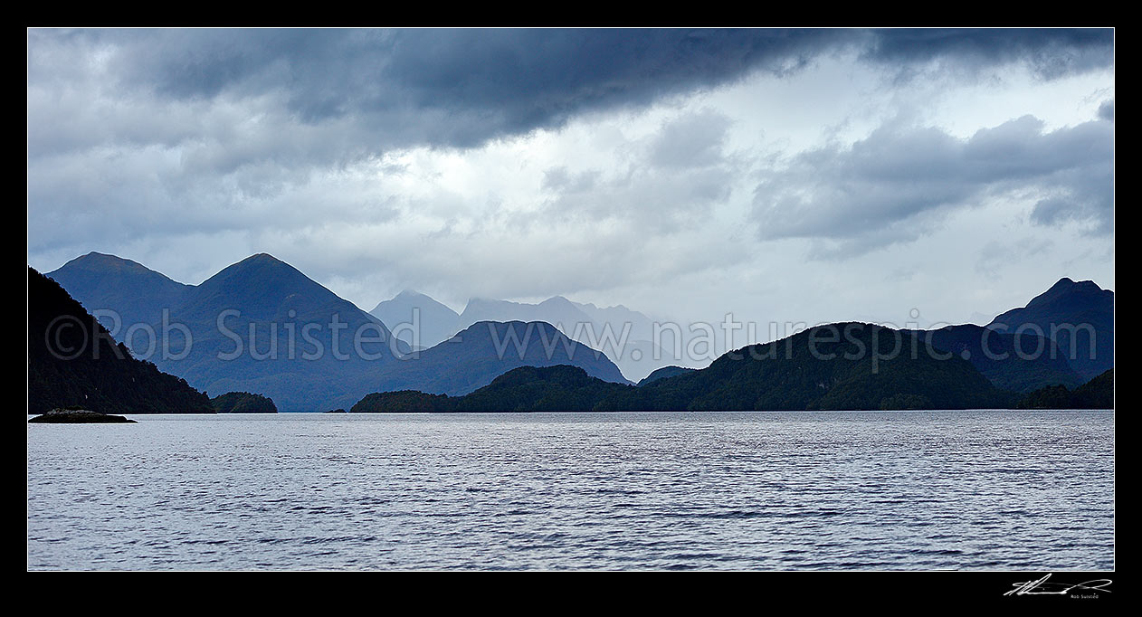 Image of Dusky Sound moody panorama. Resolution Island left and Long Island right, taken from Pickersgil Harbour, Dusky Sound, Fiordland National Park, Southland District, Southland Region, New Zealand (NZ) stock photo image