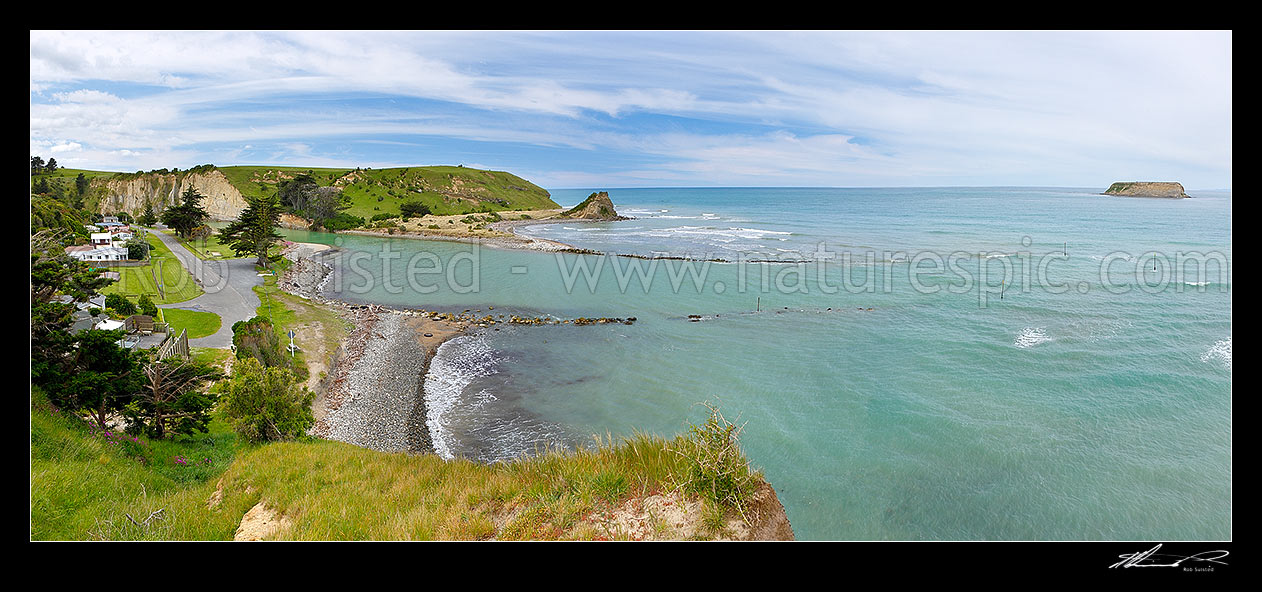 Image of Motunau Beach village, with Motunau River mouth providing small boat harbour, with Motunau Island far right, panorama, Motunau Beach, Hurunui District, Canterbury Region, New Zealand (NZ) stock photo image