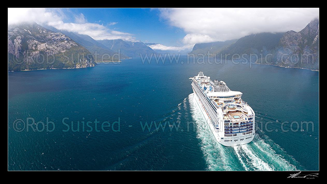 Image of Cruise ship in Thompson Sound, sailing towards Doubtful Sound. Princess Cruises Diamond Princess vessel with Secretary Island right. Aerial panorama, Thompson Sound, Fiordland National Park, Southland District, Southland Region, New Zealand (NZ) stock photo image