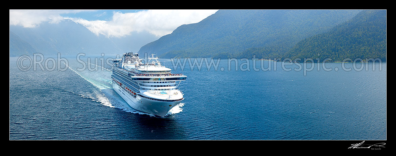 Image of Princess Cruises Diamond Princess cruise ship in Thompson Sound enroute to Doubtful Sound. Secretary Island behind left. Aerial panorama, Thompson Sound, Fiordland National Park, Southland District, Southland Region, New Zealand (NZ) stock photo image