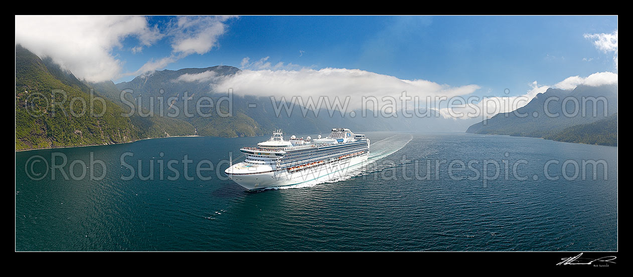 Image of Princess Cruises Diamond Princess cruise ship in Thompson Sound enroute to Doubtful Sound. Secretary Island with Hub Creek and Lieutenant Head left. Aerial panorama. Hu, Thompson Sound, Fiordland National Park, Southland District, Southland Region, New Zealand (NZ) stock photo image